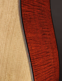 Close up of binding on an acoustic guitar