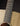 Close-up of an acoustic guitar's fretboard and soundhole on a dark background