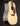 Collings acoustic guitar with a tortoiseshell pickguard on a dark background
