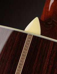 Close up of heel and backstrip on a Collings acoustic guitar.