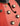 Close-up of a red electric guitar's control knobs 