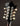 Close-up of a mandolin headstock with tuning pegs on a dark background