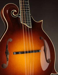 Close-up of a Collings mandolin with a dark background