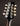 Close-up of a mandolin headstock with tuning pegs on a dark background