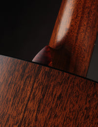 Close up of tortoise heel cap on a Collings acoustic guitar.