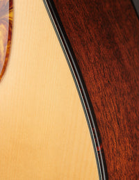 Close up of binding on an acoustic guitar