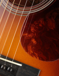 Close up a Pickguard on an Acoustic Guitar