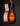 Acoustic guitar with a sunburst finish on a black background