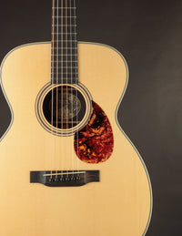 Acoustic guitar on a dark background
