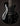 Black electric guitar with a glossy finish on a dark background