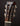 Close-up of a guitar headstock with 'Collings' branding on a dark background