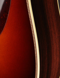Close up of binding on an acoustic guitar