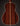 Back view of an acoustic guitar on a dark background