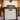 Guitar amplifier head and cab with guitars in the background