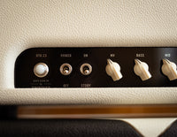 Close up of controls on guitar amplifier