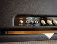 Close up of control panel on guitar amplifier