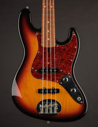 A used Lakland Shoreline Series electric bass guitar with a sunburst finish and tortoise pickguard. 