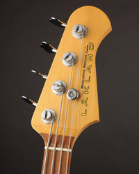 A closeup of the Lakland bass's headstock. 