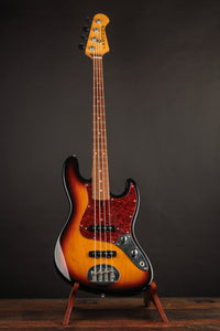 A picture of the Lakland Bass on a stand in front of a dark background.