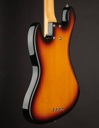 A side view of the bass's body with an emphasis on the back of the body.
