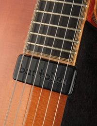 Close-up of a guitar's neck position pickup with 'Bartolini' branding.