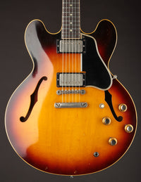 1961 Sunburst Gibson ES-335TD on a dark background