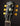 Gibson guitar headstock with tuning pegs on a dark background