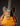 Close-up of a 1961 Sunburst Gibson ES-335TD electric guitar on a black background