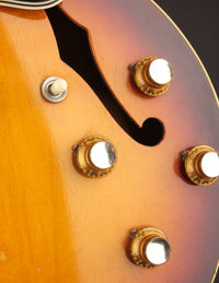 Close up of control knobs on a 1961 Sunburst Gibson ES-335TD