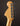 Close-up of a guitar headstock with tuning pegs on a dark background