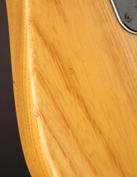 Close up of wood grain on an electric guitar

