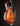 Collings electric guitar with a sunburst finish on a dark background, from the side