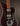 Electric guitar with a dark finish on a dark background
