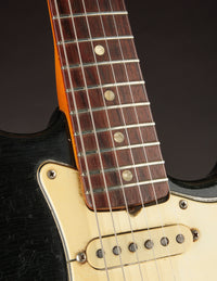 Close-up of neck and pickup on a Black 1968 Fender Stratocaster