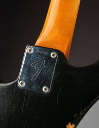 Close up of neck plate on a Black 1968 Fender Stratocaster