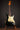 Black 1968 Fender Stratocaster on a stand against a dark background