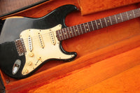 Black 1968 Fender Stratocaster in it's original hardshell case with orange interior