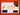 Fender guitar pick on a business card on an orange background