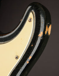 Close-up of pickguard on a Black 1968 Fender Stratocaster