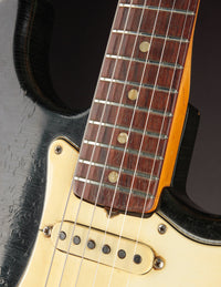 Close-up of neck and neck pickup on a Black 1968 Fender Stratocaster
