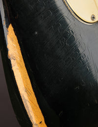 Close up of wear and finish checking on a Black 1968 Fender Stratocaster