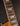 Close-up of the guitar neck with frets and strings on a dark background