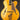 Blonde archtop guitar on a dark background