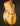 Side view of a blonde archtop guitar on a dark background