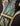 Close-up of a guitar's headstock with abalone inlay