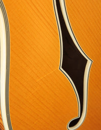 Close-up of finish checking on an archtop guitar