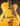 Blonde archtop guitar on a dark background