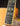 Close-up of a guitar's fretboard and pickguard on a dark background