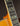 Close-up of a guitar's fretboard on a dark background