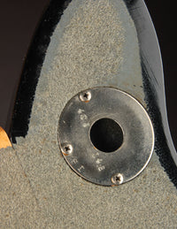 Close up strap connector an a vintage electric guitar